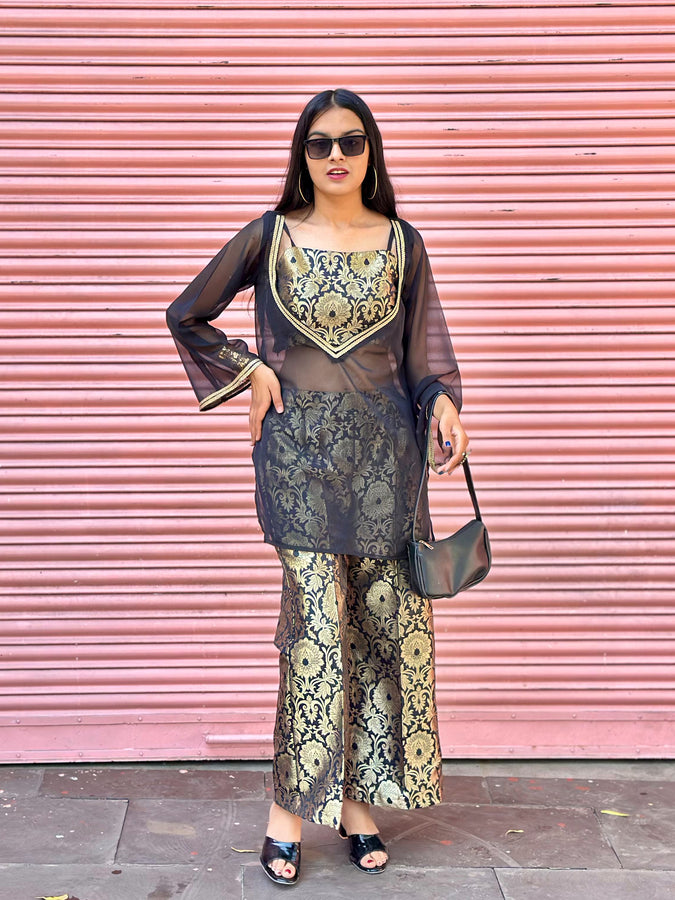 Woman in a stylish outfit with a pink shutter background